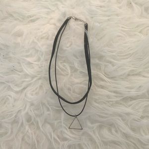 choker with little silver triangle.